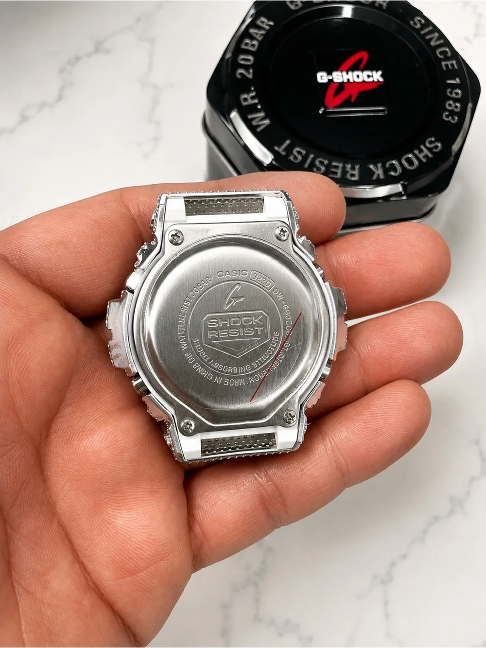 G-Shock White Watch with Silver Crystal-Encrusted Bezel and Blue Display